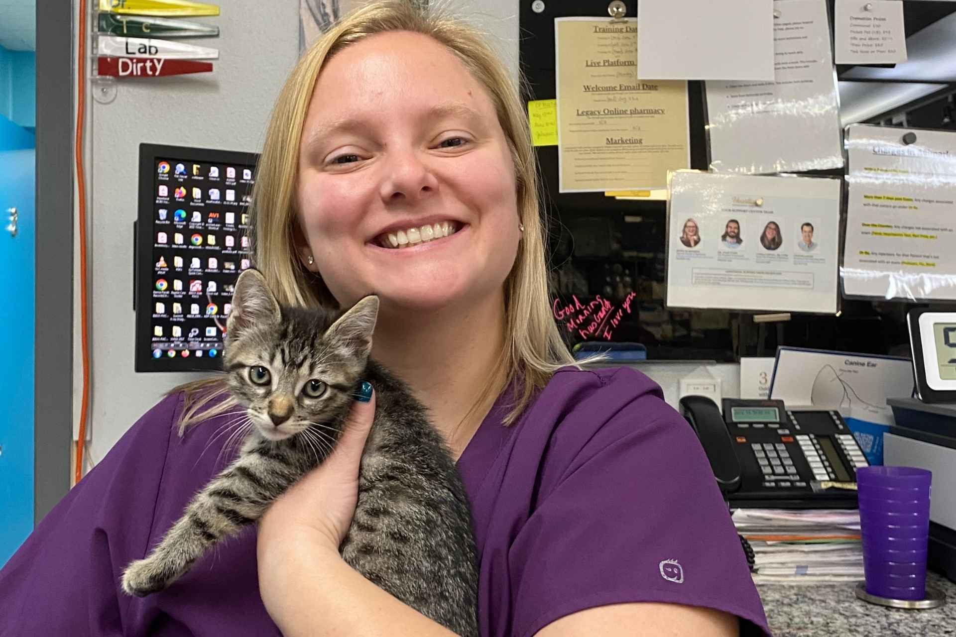 doctor holding a black cat